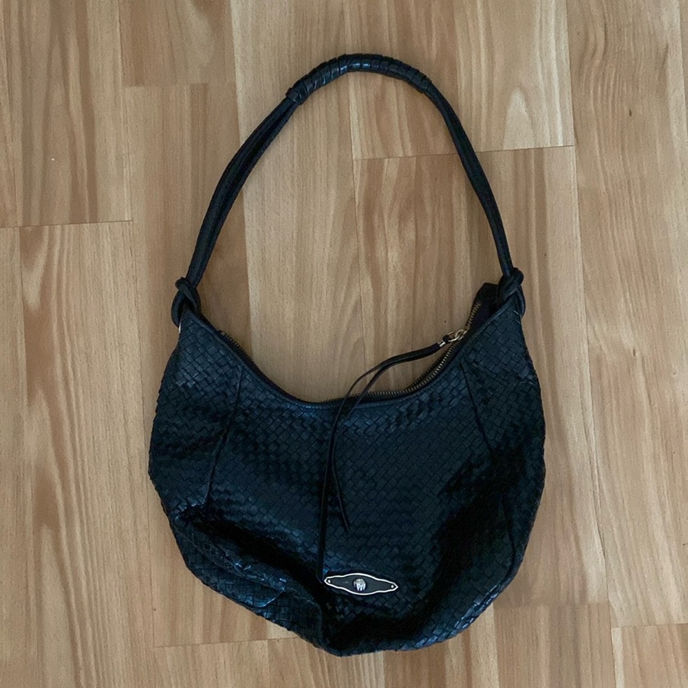 All black woven Elliot Luca bag with gold detail